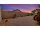 Private backyard offering low-maintenance desert landscaping and block wall fencing at 11807 E Clinton St, Scottsdale, AZ 85259