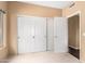 A calming bedroom featuring three closets, neutral carpet, and cozy atmosphere at 11807 E Clinton St, Scottsdale, AZ 85259