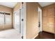 A calming bedroom featuring closets and cabinets, neutral carpet, and cozy atmosphere at 11807 E Clinton St, Scottsdale, AZ 85259