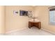A calming bedroom featuring an unique desk, neutral carpet, and cozy atmosphere at 11807 E Clinton St, Scottsdale, AZ 85259