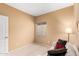 A calming bedroom featuring a comfortable sofa, neutral carpet, and cozy atmosphere at 11807 E Clinton St, Scottsdale, AZ 85259
