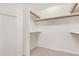 Walk-in closet with built-in shelving and rods, offering ample storage space at 11807 E Clinton St, Scottsdale, AZ 85259