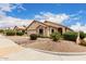 Charming home exterior with mature landscaping, enhancing curb appeal and creating a welcoming entrance at 11807 E Clinton St, Scottsdale, AZ 85259