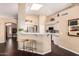 Bright kitchen with skylights, counter seating, and white cabinets at 11807 E Clinton St, Scottsdale, AZ 85259