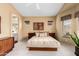 Spacious primary bedroom featuring cozy carpet, recessed lighting, and backyard access at 11807 E Clinton St, Scottsdale, AZ 85259