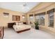 Spacious primary bedroom featuring carpet, recessed lighting, and large windows at 11807 E Clinton St, Scottsdale, AZ 85259