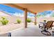 Inviting covered patio with comfortable seating, perfect for enjoying the outdoor space and Arizona weather at 11807 E Clinton St, Scottsdale, AZ 85259