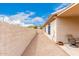 Side yard featuring low maintenance landscaping, providing a clean and attractive outdoor space at 11807 E Clinton St, Scottsdale, AZ 85259