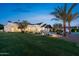 Expansive backyard with lush lawn, pool, and modern outdoor living space, perfect for relaxation and entertainment at 12240 N 98Th St, Scottsdale, AZ 85260