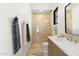 Well-lit bathroom with a tiled shower, modern vanity, and neutral tones at 12240 N 98Th St, Scottsdale, AZ 85260