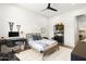 Comfortable bedroom featuring modern décor, a ceiling fan, and ample natural light at 12240 N 98Th St, Scottsdale, AZ 85260