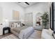 Serene bedroom with neutral tones, soft textures, and elegant lighting, providing a peaceful retreat at 12240 N 98Th St, Scottsdale, AZ 85260