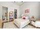 Charming bedroom featuring a plush rug, closet, and a cozy bed with decorative pillows at 12240 N 98Th St, Scottsdale, AZ 85260