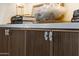 Close-up of custom cabinetry with fluted wood texture, quartz countertop, and decorative quartz hardware at 12240 N 98Th St, Scottsdale, AZ 85260