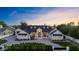 A lovely home boasts a large green lawn, exterior lights, a manicured landscape, and a long driveway at 12240 N 98Th St, Scottsdale, AZ 85260