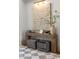 Elegant foyer with stylish console table, artwork, and checkered flooring creates a welcoming entrance at 12240 N 98Th St, Scottsdale, AZ 85260