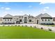 Stately single-story home with manicured lawn, circular driveway, and elegant curb appeal at 12240 N 98Th St, Scottsdale, AZ 85260