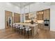 Spacious kitchen with marble island, stainless steel appliances, wood cabinets, and pendant lighting at 12240 N 98Th St, Scottsdale, AZ 85260