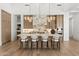 Gourmet kitchen with marble island, custom cabinetry, pendant lighting and stainless steel appliances at 12240 N 98Th St, Scottsdale, AZ 85260