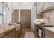 Chef's kitchen with marble countertops, custom cabinets, and stainless steel appliances create a culinary dream at 12240 N 98Th St, Scottsdale, AZ 85260