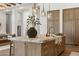 Close-up view of the kitchen island featuring marble countertop, custom cabinetry, and ample storage space at 12240 N 98Th St, Scottsdale, AZ 85260