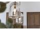 Close up of hanging glass pendant lights in kitchen at 12240 N 98Th St, Scottsdale, AZ 85260