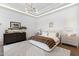 Bright main bedroom with tray ceiling, stylish furniture, and decorative rug at 12240 N 98Th St, Scottsdale, AZ 85260