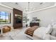 Tranquil primary bedroom featuring a fireplace, modern lighting, and a cozy seating area at 12240 N 98Th St, Scottsdale, AZ 85260