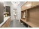 Well-organized mudroom with built-in storage and convenient bench seating at 12240 N 98Th St, Scottsdale, AZ 85260