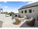 Outdoor patio with a fireplace, comfortable seating, and elegant design, perfect for relaxing at 12240 N 98Th St, Scottsdale, AZ 85260