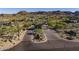 Community entrance featuring desert landscaping, mountains in the background, and an entry gate at 12311 E Black Rock Rd, Scottsdale, AZ 85255