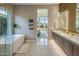 Bright bathroom featuring a soaking tub, dual vanities, and views of the main bedroom at 12311 E Black Rock Rd, Scottsdale, AZ 85255