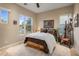 Comfortable bedroom with warm natural light and a decorative leather chair at 12311 E Black Rock Rd, Scottsdale, AZ 85255