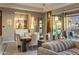 Dining room with pendant lighting and backyard mountain views through the large sliding glass door at 12311 E Black Rock Rd, Scottsdale, AZ 85255
