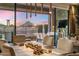 Dining area with scenic views, modern lighting, and stylish décor for elegant entertaining at 12311 E Black Rock Rd, Scottsdale, AZ 85255
