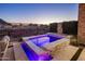 Relaxing hot tub with LED lighting surrounded by lush landscaping and mountain views at 12311 E Black Rock Rd, Scottsdale, AZ 85255