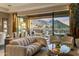 Comfortable living room showcasing an open layout with mountain views from the sliding glass doors at 12311 E Black Rock Rd, Scottsdale, AZ 85255