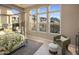 Bright main bedroom with mountain views and a canopy bed dressed in a tropical print at 12311 E Black Rock Rd, Scottsdale, AZ 85255