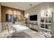 Home office featuring custom shelving, artwork, and a modern aesthetic at 12311 E Black Rock Rd, Scottsdale, AZ 85255