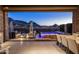 Outdoor living space with a hot tub, fire pit, and views of the mountains at 12311 E Black Rock Rd, Scottsdale, AZ 85255