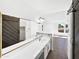 Bathroom featuring a double vanity, tile flooring, and a modern sliding barn door at 12342 S Shoshoni Dr, Phoenix, AZ 85044