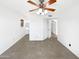 Bright bedroom with ceiling fan, tile floor, and an open doorway at 12342 S Shoshoni Dr, Phoenix, AZ 85044