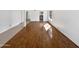 Spacious living room with wood flooring, white walls, and lots of natural light at 12342 S Shoshoni Dr, Phoenix, AZ 85044