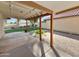 Covered patio overlooking landscaped backyard with artificial turf and brick pavers at 12342 S Shoshoni Dr, Phoenix, AZ 85044