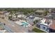 Aerial view showcasing a home with a pool, solar panels, a fenced yard, and desert landscaping at 1285 E Mcmurray Blvd, Casa Grande, AZ 85122