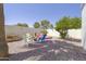 Backyard with fire pit and seating area with colorful chairs at 1285 E Mcmurray Blvd, Casa Grande, AZ 85122