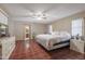 Spacious bedroom featuring red tile flooring, ceiling fan and connecting bath at 1285 E Mcmurray Blvd, Casa Grande, AZ 85122