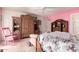 Bedroom showcasing unique furniture and decor elements against pink and white walls at 1309 E Meadow Ln, Phoenix, AZ 85022
