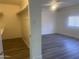 Bright bedroom featuring a walk-in closet and new gray wood flooring at 1452 E Emerald Ave, Mesa, AZ 85204