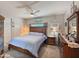 Cozy bedroom featuring a ceiling fan, carpet floors, and a wooden bed frame at 15203 N 153Rd Dr, Surprise, AZ 85379